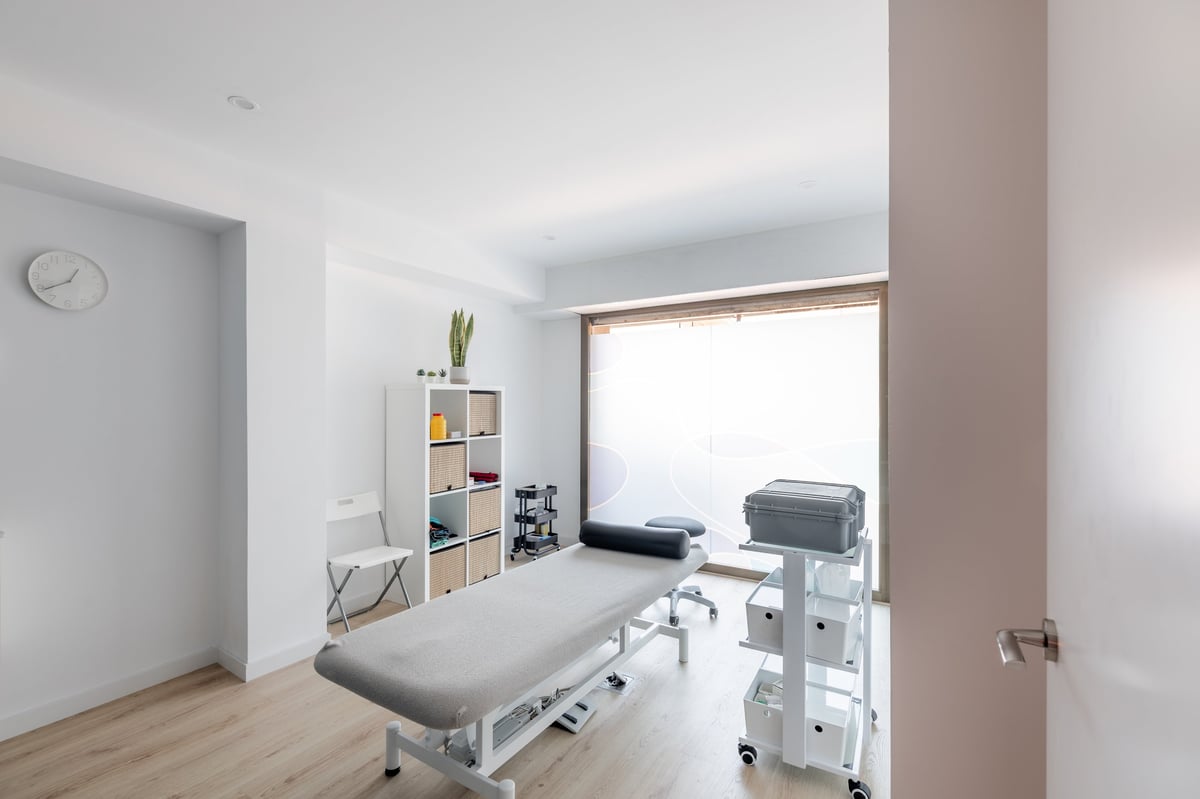 Modern physiotherapy treatment room with rehabilitation equipment
